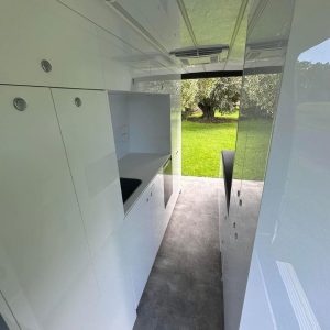 ample storage with floor to ceiling storage in this converted van